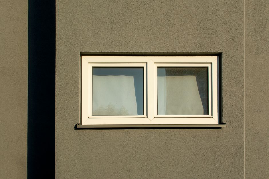 Close-up detail of a modern white vinyl window frame